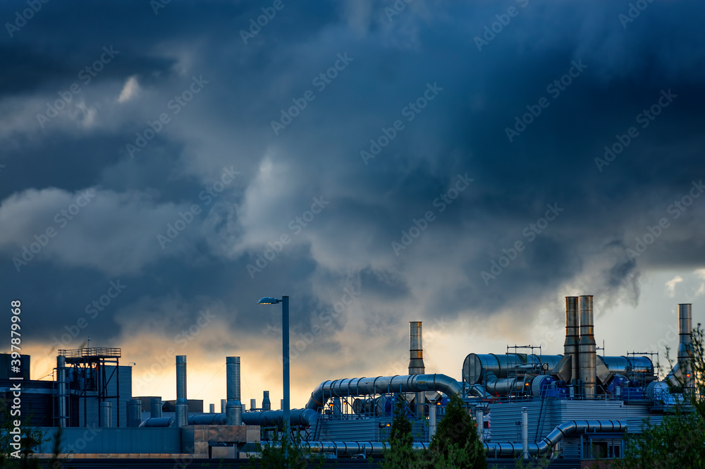 Storm rolls in over industrial site