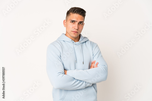 Young caucasian handsome man isolated unhappy looking in camera with sarcastic expression.