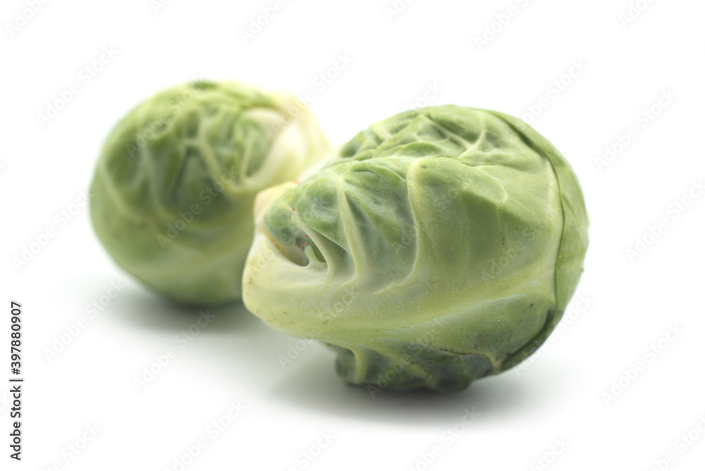 Fototapeta premium Closeup of organic brussels sprouts on white background