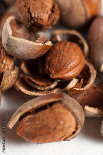 Hazelnuts and cracked nutshells