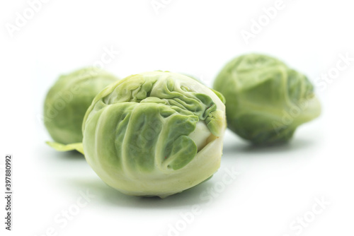 Closeup of organic brussels sprouts on white background © pixarno