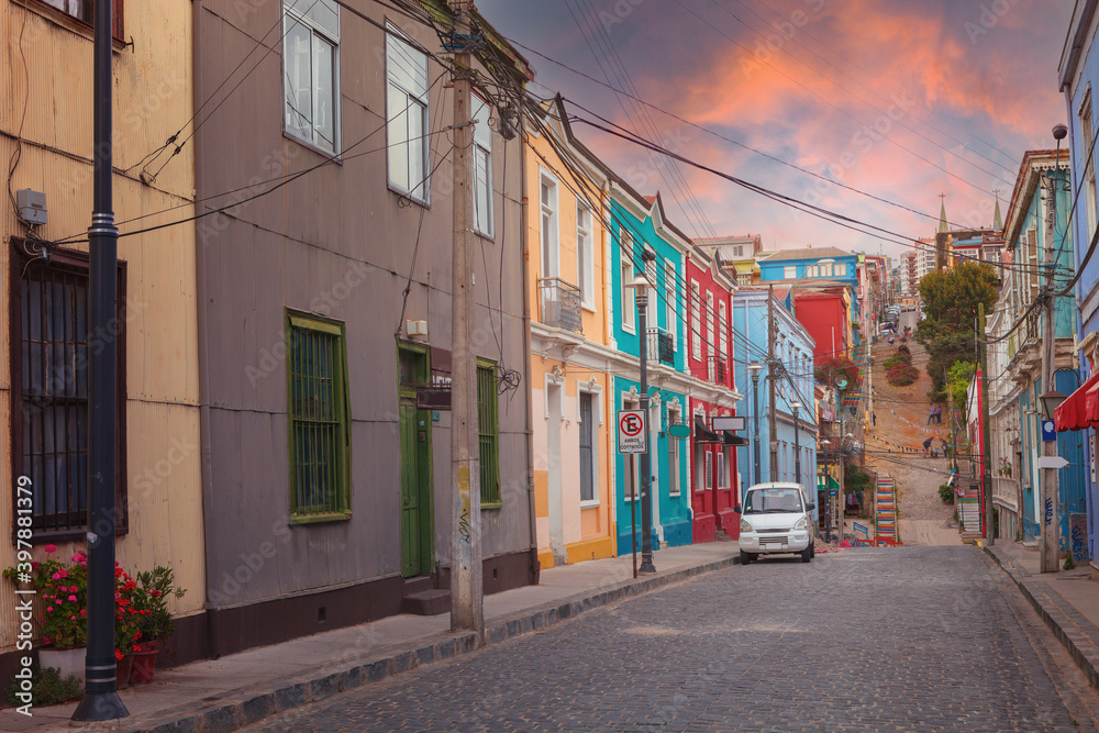 Street with colorful facades of old historic buildings in Valparaiso, Chile