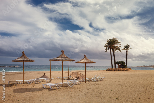 Landscape of Garrucha beach, with deckchairs and umbrellas in spring, Almería, Spain