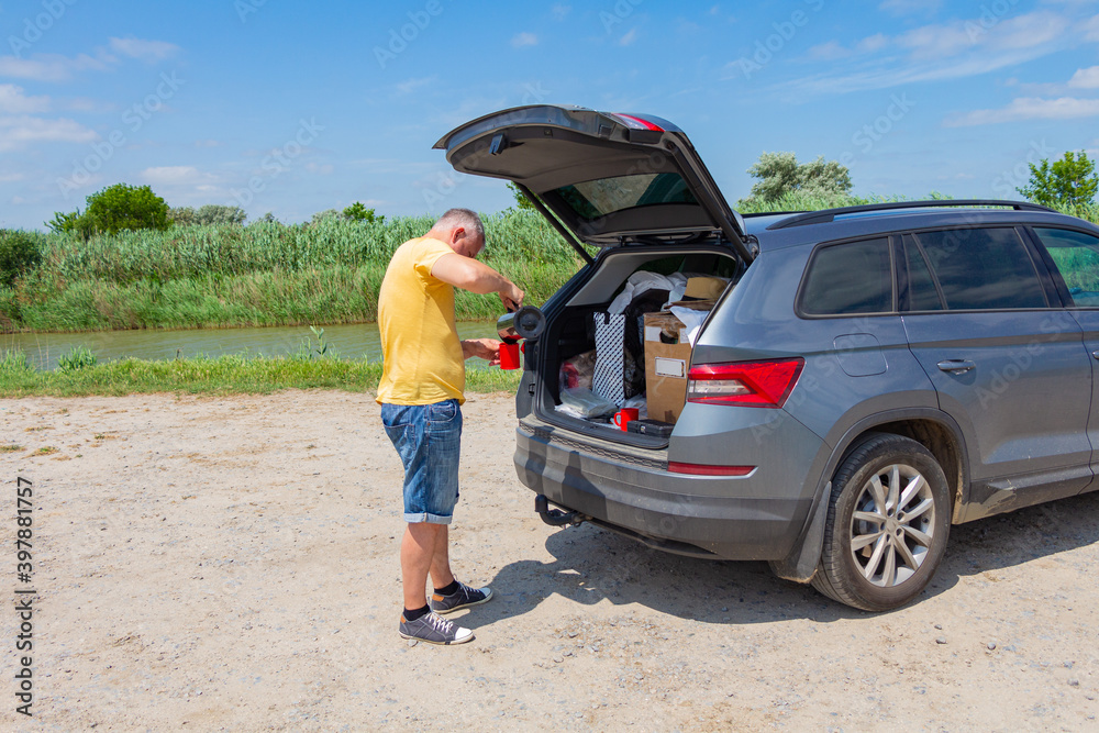 A man standing next to a car. High quality photo A man standing next to a car. High quality photo