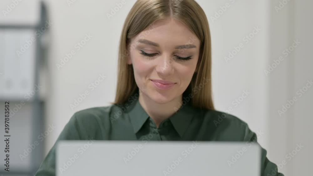 Portrait of Thumbs up by Woman with Laptop 