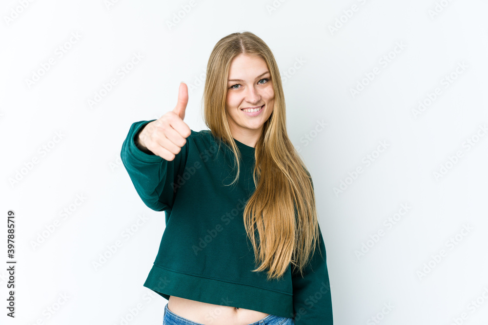 Young blonde woman isolated on white background smiling and raising thumb up Young blonde woman isolated on white background smiling and raising thumb up