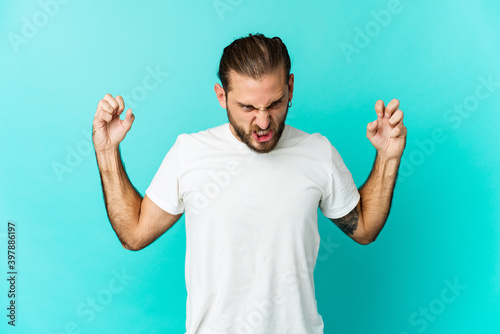 Photos Young man with long hair look screaming with rage.