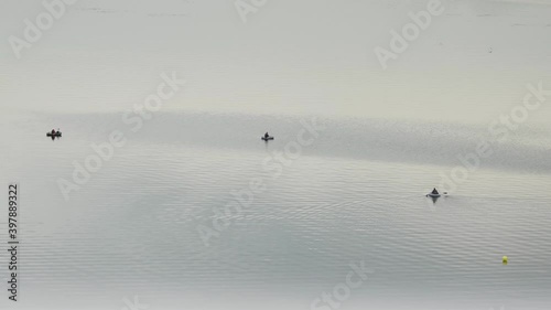 Fishermen on the water catch fish - kind of from afar