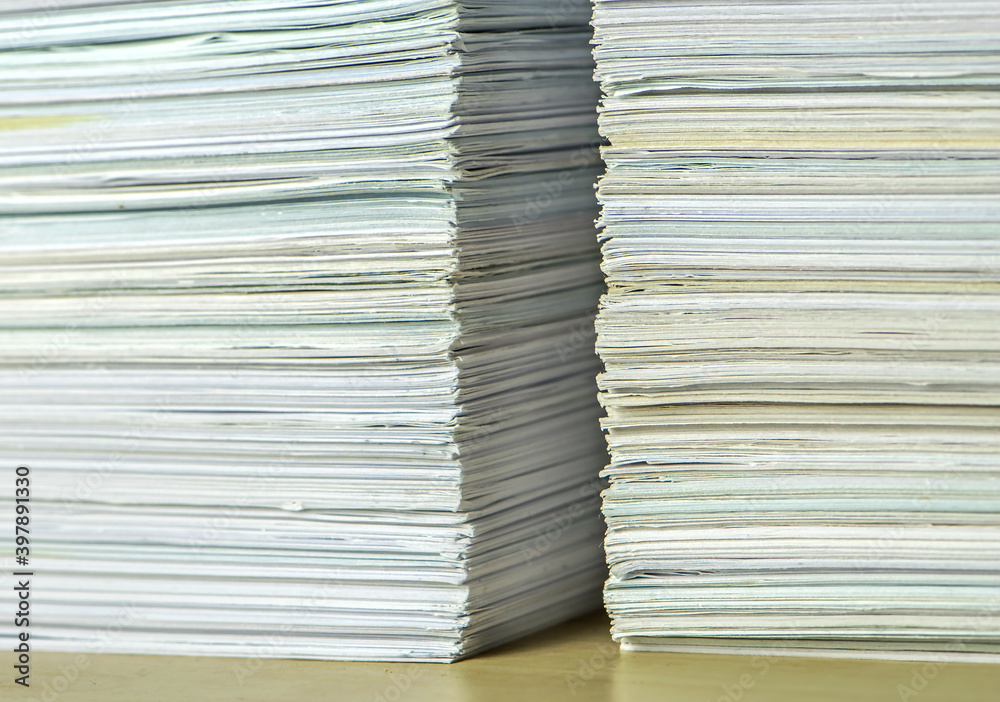 bundles bales of paper documents. stacks packs pile on the desk in the office bundles bales of paper documents. stacks packs pile on the desk in the office