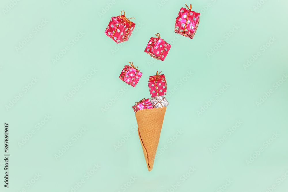 Ice Cream Cone with gift boxes. Minimal Holiday sale present concept. Flat Lay Ice Cream Cone with gift boxes. Minimal Holiday sale present concept. Flat Lay