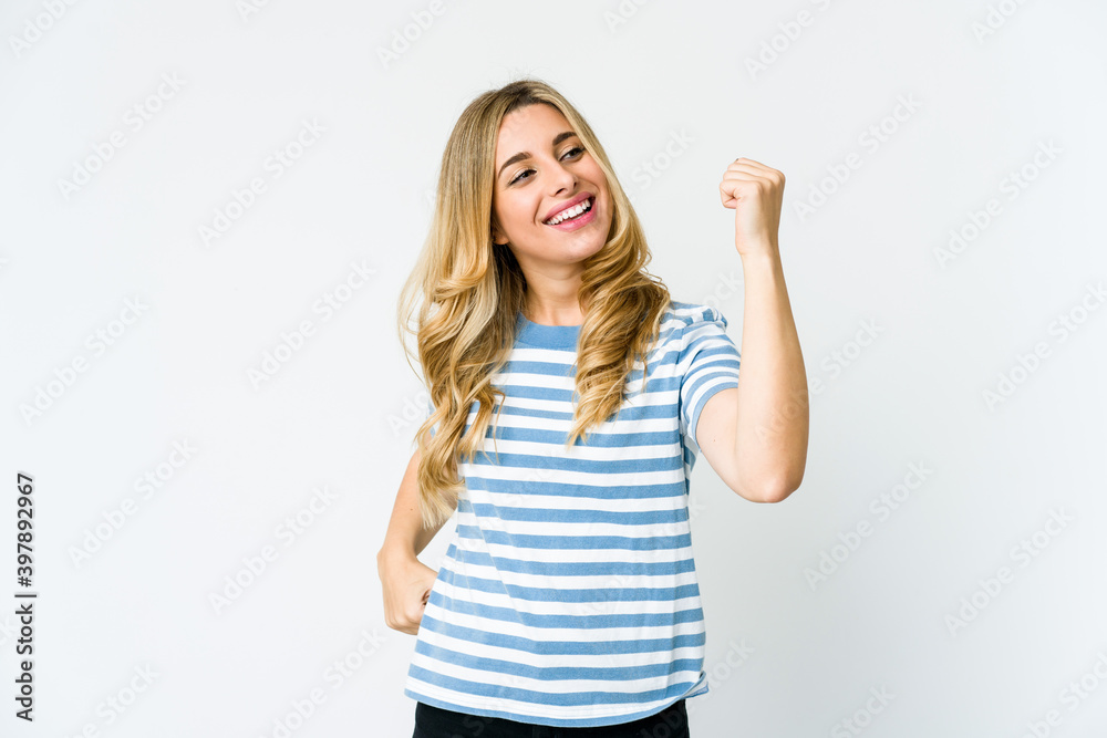 Fototapeta premium Young caucasian blonde woman cheering carefree and excited. Victory concept.