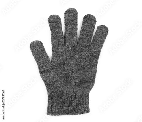 Grey woolen glove on white background, top view. Winter clothes