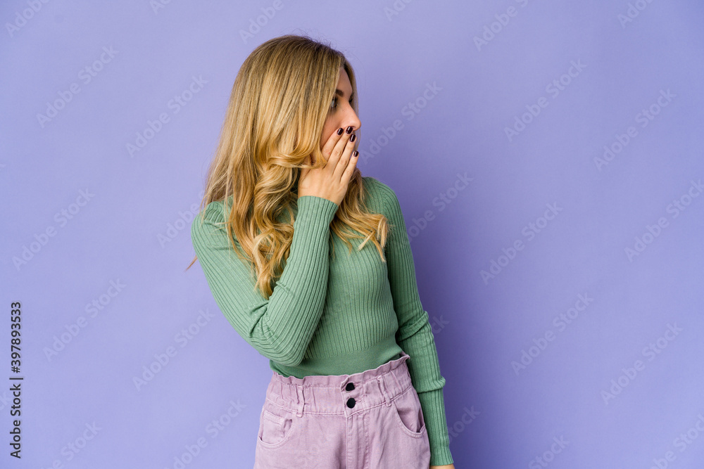 Young caucasian blonde woman being shocked because of something Young caucasian blonde woman being shocked because of something