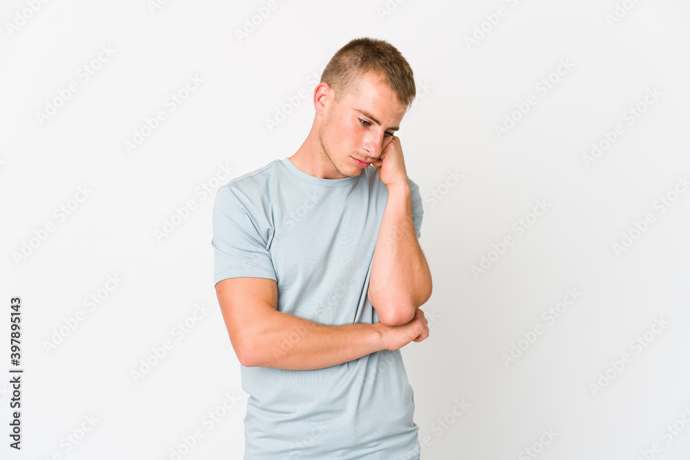 Young caucasian handsome man who feels sad and pensive, looking at copy space. Young caucasian handsome man who feels sad and pensive, looking at copy space.