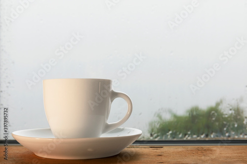 Cup of coffee on the old table, close-up