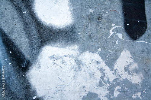 The wall is covered with old peeling plaster, painted in different colors.Backgrounds and textures.	