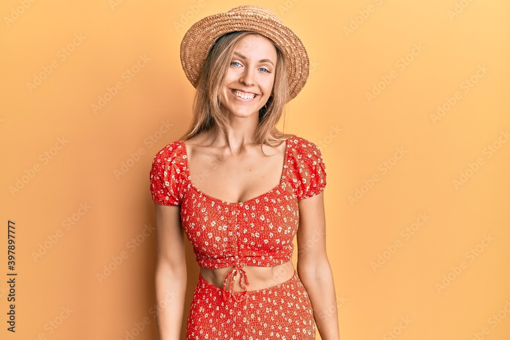 Beautiful caucasian woman wearing summer hat with a happy and cool smile on face. lucky person. Beautiful caucasian woman wearing summer hat with a happy and cool smile on face. lucky person.