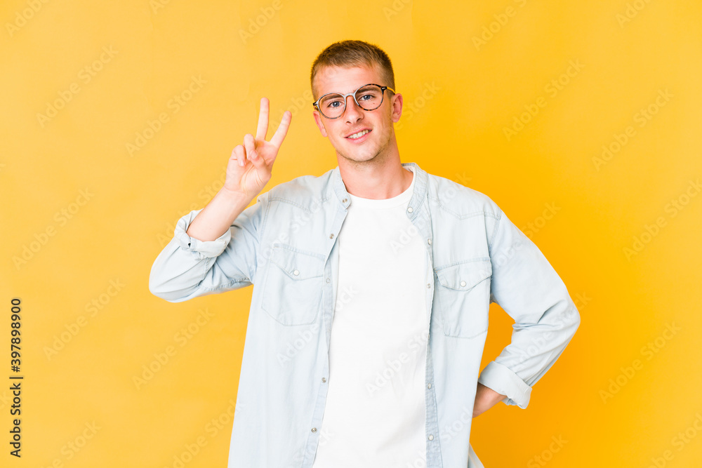 Young caucasian handsome man showing number two with fingers. Young caucasian handsome man showing number two with fingers.