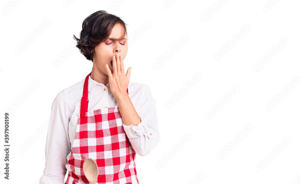Beautiful young woman with short hair wearing professional cook apron bored yawning tired covering mouth with hand. restless and sleepiness. Beautiful young woman with short hair wearing professional cook apron bored yawning tired covering mouth with hand. restless and sleepiness.