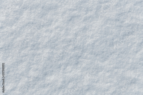 Bright snow surface as background texture. Top view.
