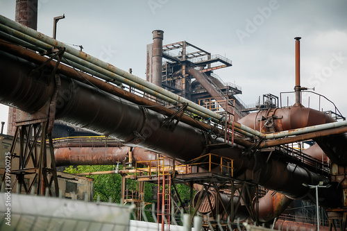 Old rusty mechanism of pipeline, former ironworks, revamped industrial park, Closed metallurgical plant, Dolni oblast Vitkovice (The Lower Vitkovice area), Ostrava, Czech Republic