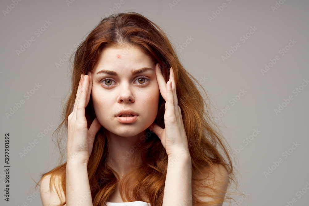 portrait of beautiful woman with red hair on gray background cropped view emotion portrait of beautiful woman with red hair on gray background cropped view emotion