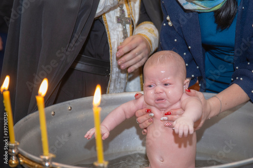 Little girl baptised in church and bathed in a bowl for baptism Tapéta, Fotótapéta