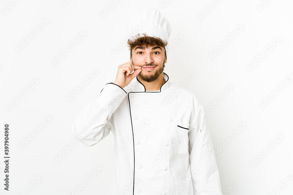 Young arab cook man with fingers on lips keeping a secret. Young arab cook man with fingers on lips keeping a secret.