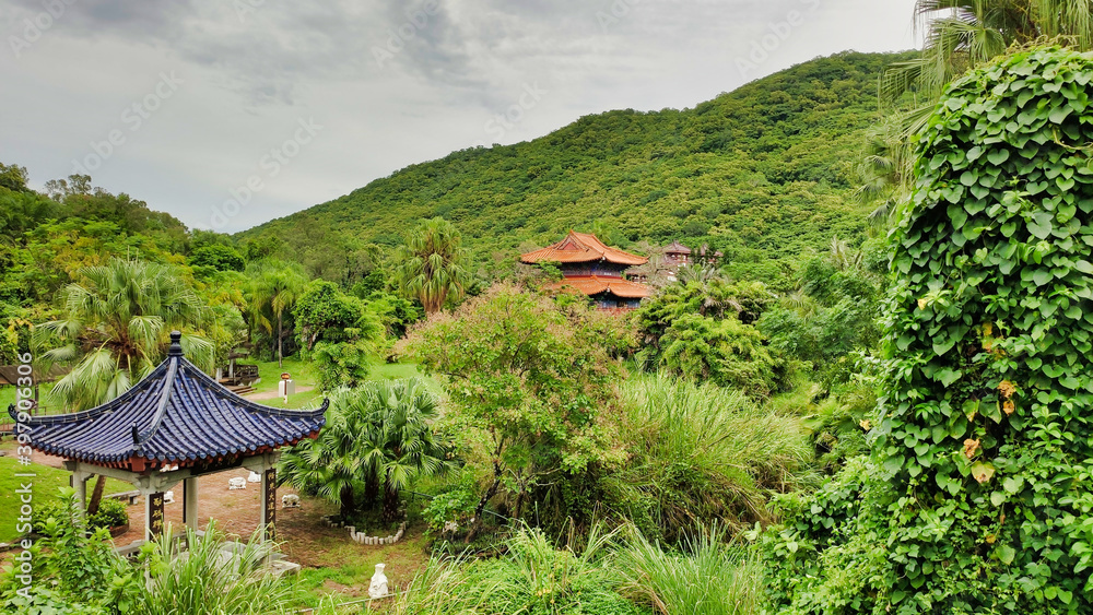 View of the pagoda, pavilion and palm tops. Nanshan Cultural Tourism Zone. Sanya. Hainan Island. China. Asia View of the pagoda, pavilion and palm tops. Nanshan Cultural Tourism Zone. Sanya. Hainan Island. China. Asia
