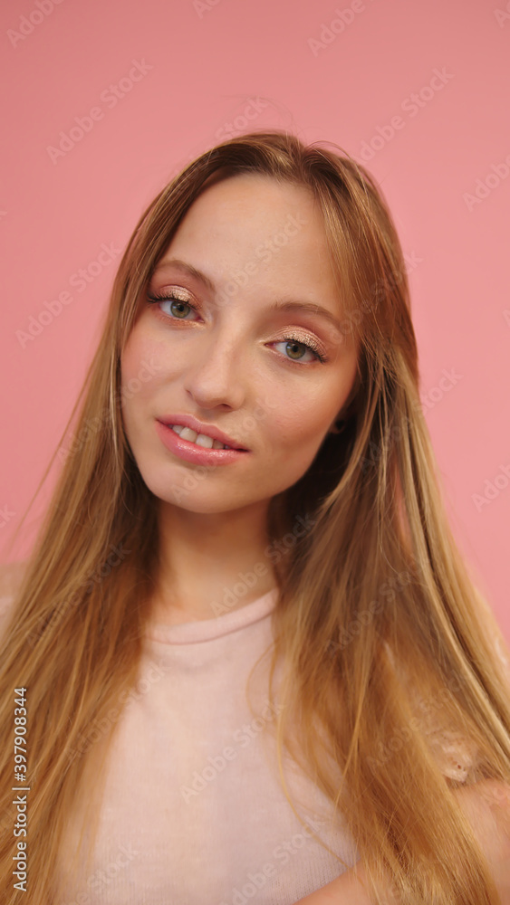 Portrait of beautiful smiling caucasian woman isolated on pink background. High quality photo Portrait of beautiful smiling caucasian woman isolated on pink background. High quality photo