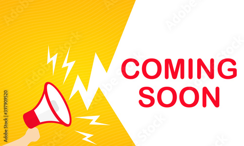 Hand holding megaphone with Coming soon text banner. Announcement. Loudspeaker. For business, promotion and advertising. Vector on isolated white background. EPS 10