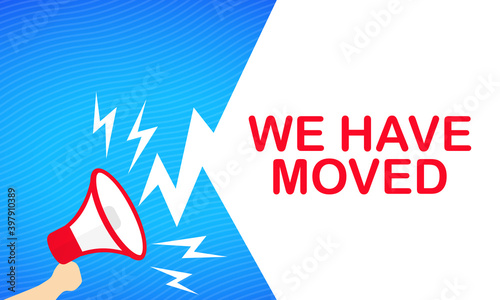 Hand holding megaphone with We have moved text banner. Announcement. Loudspeaker. For business, promotion and advertising. Vector on isolated white background. EPS 10