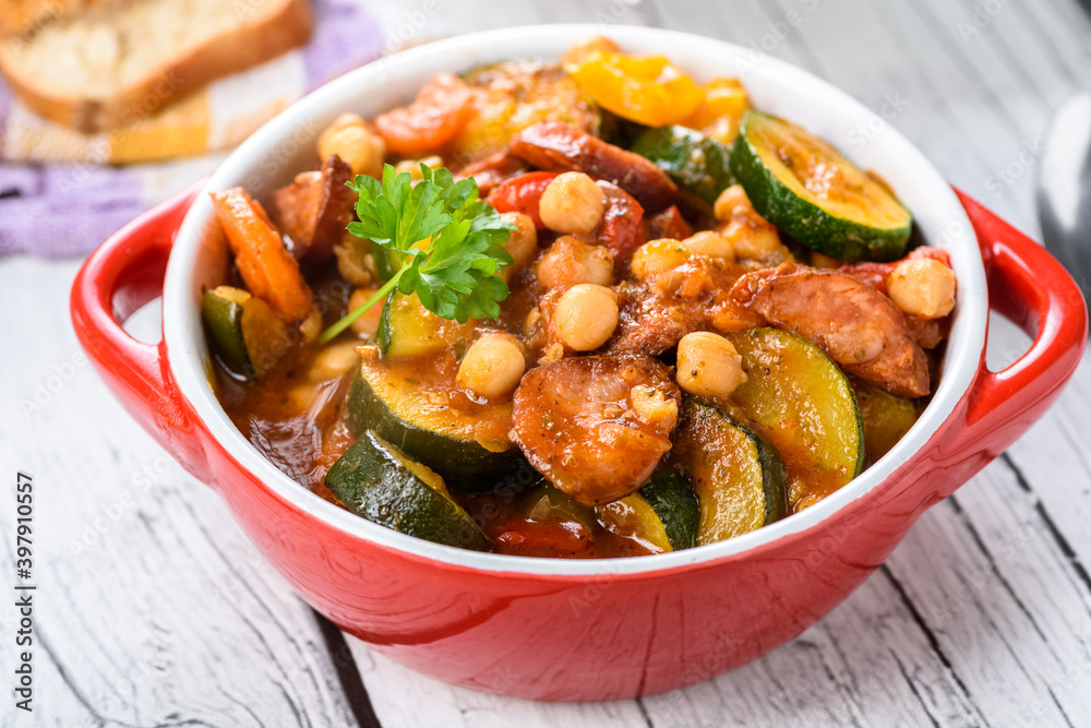 Spanish pot - pot meal with vegetables and sausage Spanish pot - pot meal with vegetables and sausage