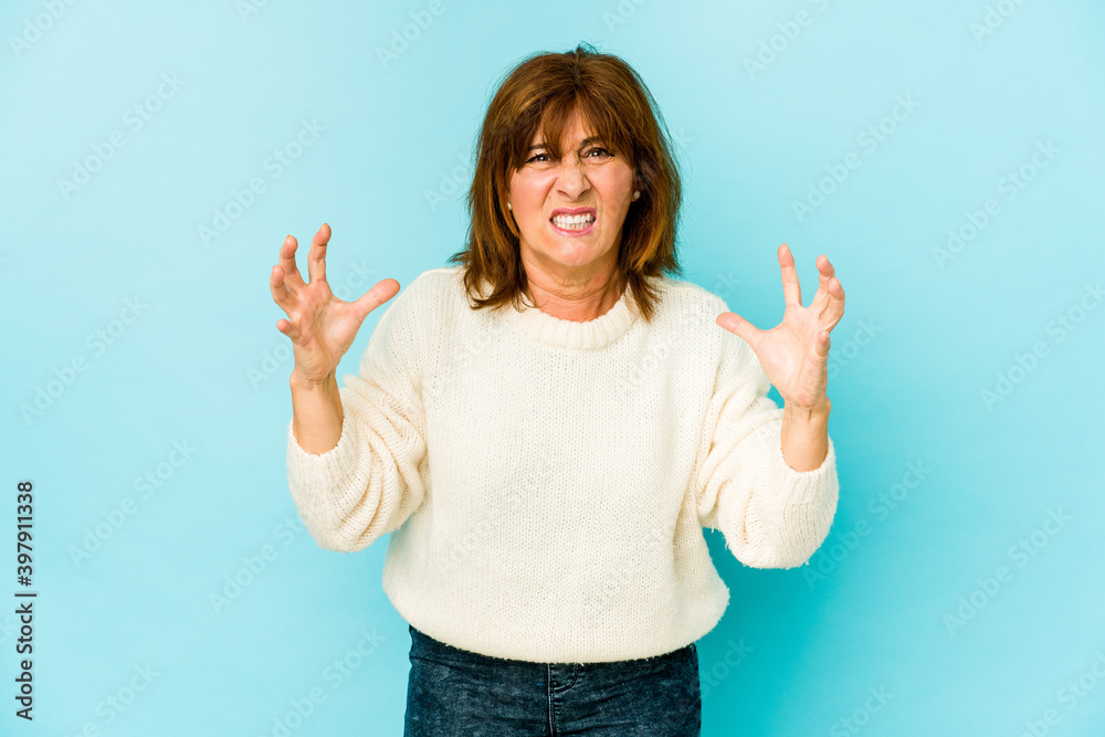 Senior caucasian woman isolated screaming with rage. Senior caucasian woman isolated screaming with rage.