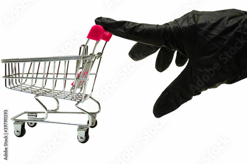  shopping cart and hand in black feather on white background safe shopping concept © Ольга Сафронова