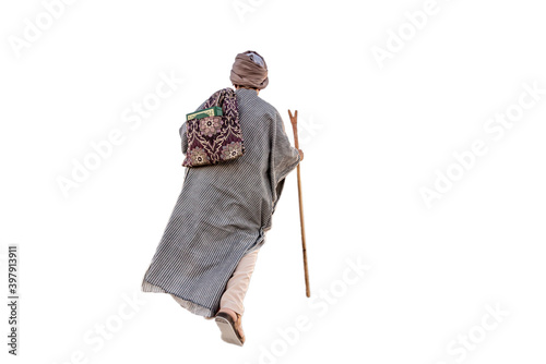 фотографія Muslim traveler dervish walking on dry soil
