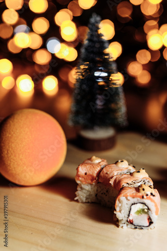 Sushi rolls New Year. Christmas background. Idea for postcard, menu, advertising.