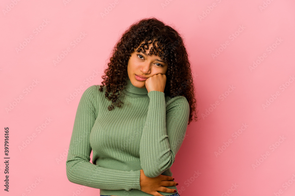 Young african american afro woman isolated who feels sad and pensive, looking at copy space. Young african american afro woman isolated who feels sad and pensive, looking at copy space.