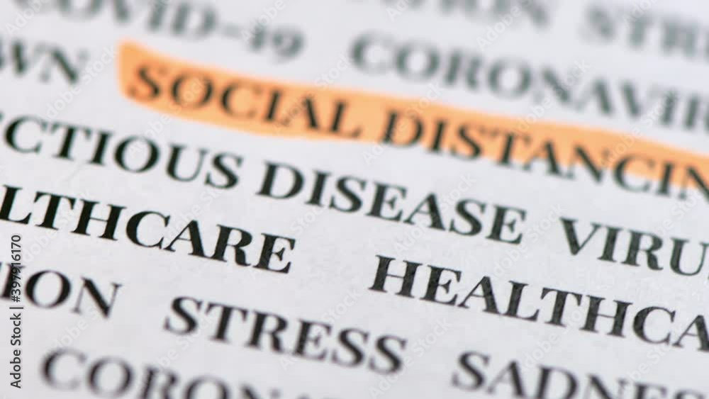 A macro shot of the words on the news article. Social distancing A macro shot of the words on the news article. Social distancing