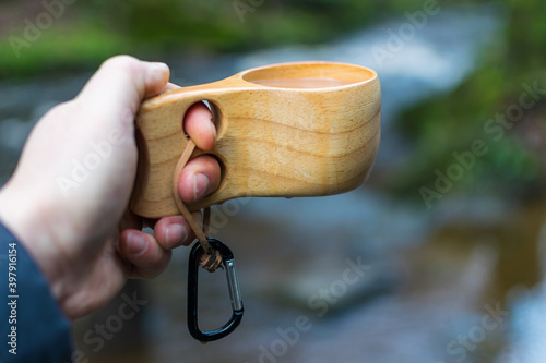 Hand holding Kuksa Mug photo