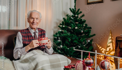 Bild auf Leinwand Portrait of Senior Retired Man Sitting at Home