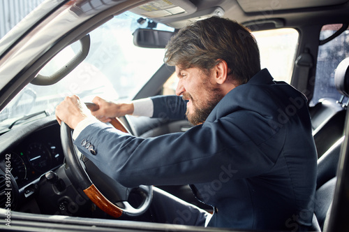 emotional man driving a car gesturing with his hands road track © SHOTPRIME STUDIO