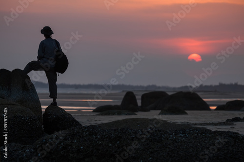Sunset on the beach. UNRECOGNIZABLE PERSON, DOESN'T NEED MODEL RELEASE