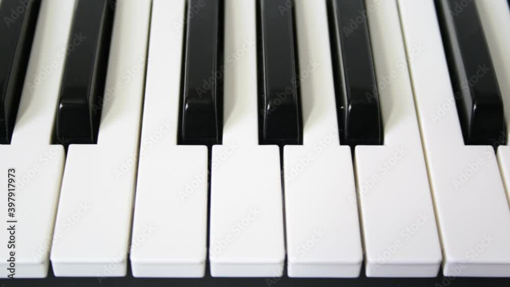 Loopable motion over piano keys white and black. Seamless music background Loopable motion over piano keys white and black. Seamless music background