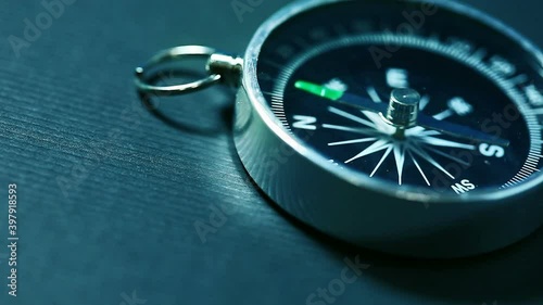 Rotating compass arrow. Tool for navigation HD video 1920x1080. Shalow depth of field photo