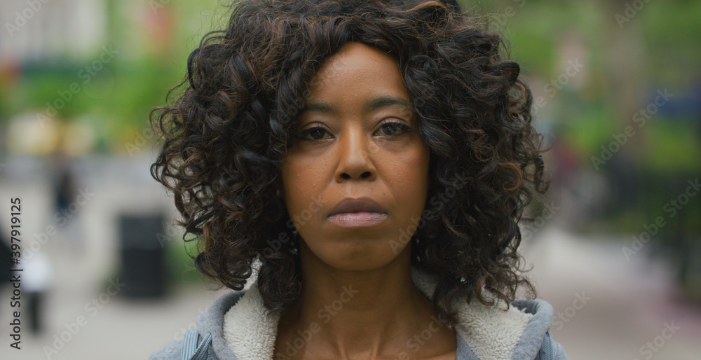Black African American woman in city serious sad face portrait Black African American woman in city serious sad face portrait