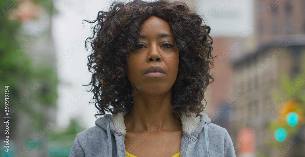 Black African American woman in city serious face portrait Black African American woman in city serious face portrait