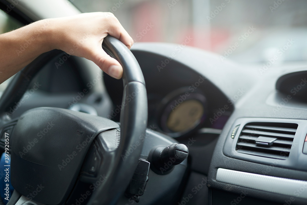 Male driving a car