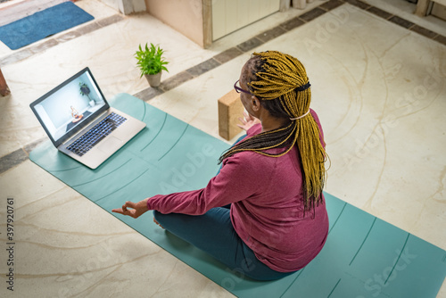 a black woman practices crying at home online with her laptop