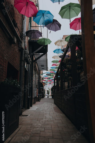 Umbrellas hung as art in alley in Redlands, California photo